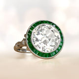 Platinum European cut Diamond and Emerald Halo set Ring